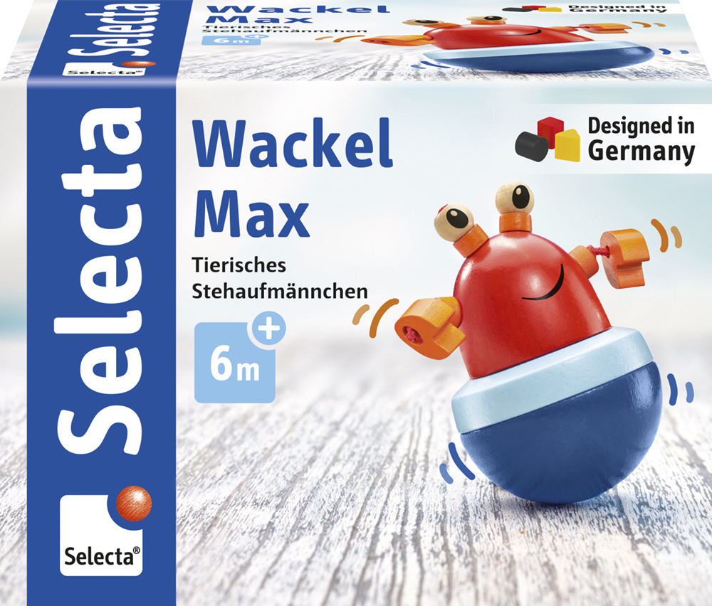 61028_Rolina_FS08_09_2019 Spielzeugverpackung für „Wackel Max“, einen rot-blauen Holz-Wackelkreisel in Form einer Krabbe, ab 6 Monaten.