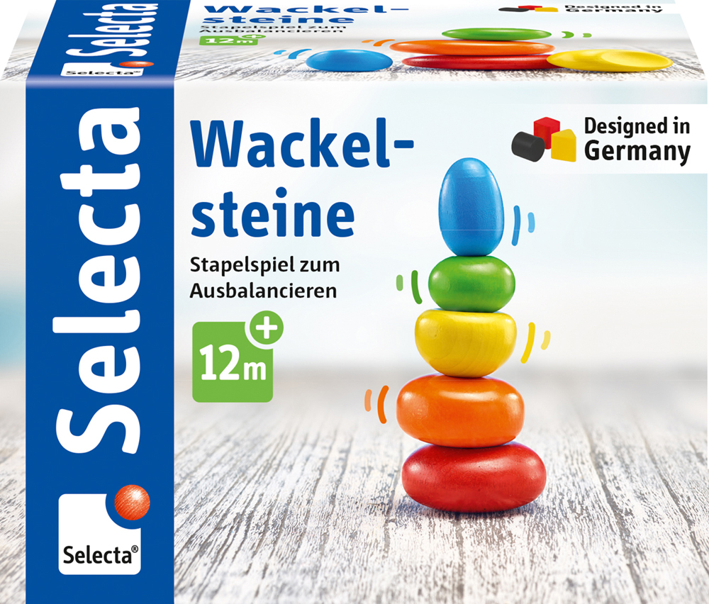 61028_Rolina_FS08_09_2019 Bunte Holz-Wackelsteine sind auf einer Spieleschachtel mit der Aufschrift „Wackelsteine“ gestapelt; geeignet für Kinder ab 12 Monaten.