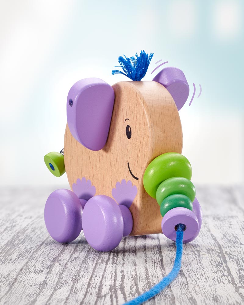 Bunter Nachzieh-Elefant aus Holz mit Glocke.