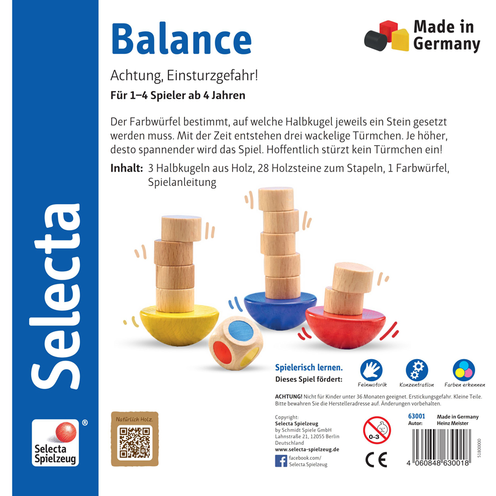 63001_balance-holz-spielzeug-p-bottom Drei farbige „Holz Balancespiel“-Halbkugeln halten gestapelte Scheiben im Gleichgewicht; auf der Schachtel sind deutsche Geschicklichkeitsdetails abgebildet.